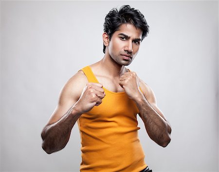 simsearch:400-04599868,k - Handsome Indian man prepared to fight Foto de stock - Super Valor sin royalties y Suscripción, Código: 400-07570330