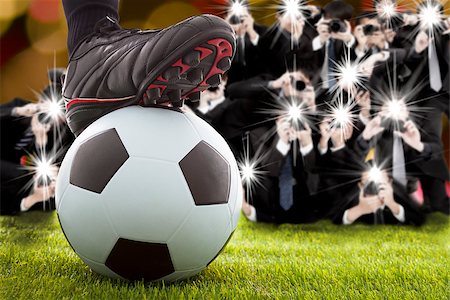 many photographer taking winner soccer player feet on field Foto de stock - Super Valor sin royalties y Suscripción, Código: 400-07570663