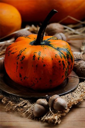 simsearch:400-05693480,k - Autumn concept. Pumpkin on wooden plate. Stock Photo - Budget Royalty-Free & Subscription, Code: 400-07570762
