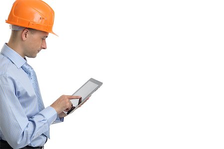 Young construction worker with digital tablet. Isolated Stock Photo - Budget Royalty-Free & Subscription, Code: 400-07571003