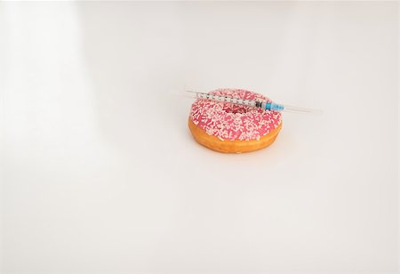 simsearch:400-07510795,k - Closeup on donut and diabetes syringe on table Stock Photo - Budget Royalty-Free & Subscription, Code: 400-07572100