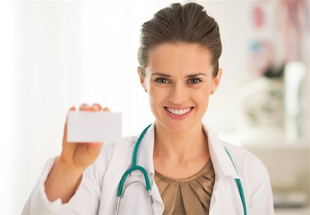 simsearch:400-07099823,k - Portrait of happy medical doctor woman showing business card Stock Photo - Budget Royalty-Free & Subscription, Code: 400-07572118