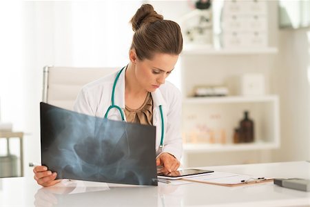 simsearch:400-07519214,k - Medical doctor woman with fluorography working in office Stock Photo - Budget Royalty-Free & Subscription, Code: 400-07572120