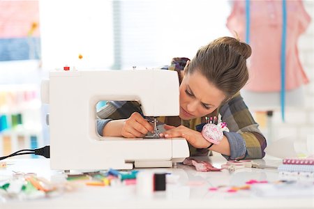 Seamstress working with sewing machine Stock Photo - Budget Royalty-Free & Subscription, Code: 400-07572188