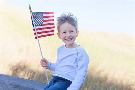 simsearch:400-07626725,k - cute little boy holding american flag and celebrating independence day Photographie de stock - Aubaine LD & Abonnement, Code: 400-07572965