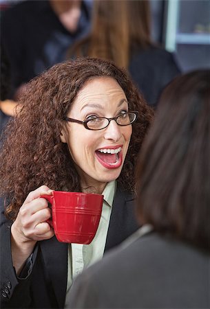simsearch:400-07553657,k - Surprised woman laughing with friend in coffee house Stockbilder - Microstock & Abonnement, Bildnummer: 400-07573260