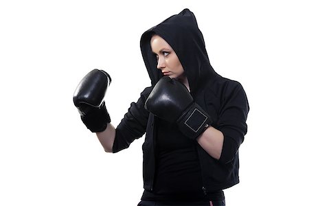 pzromashka (artist) - Young serious woman in boxing gloves on a white background Foto de stock - Royalty-Free Super Valor e Assinatura, Número: 400-07584634