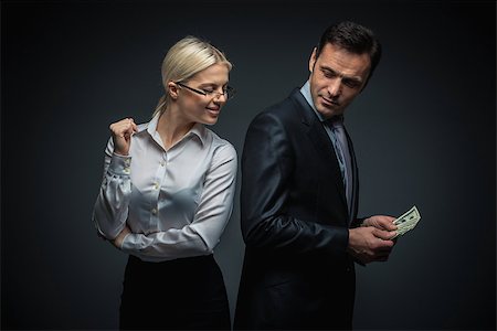 simsearch:400-04610806,k - Businessman and businesswoman with money Stock Photo - Budget Royalty-Free & Subscription, Code: 400-07580014