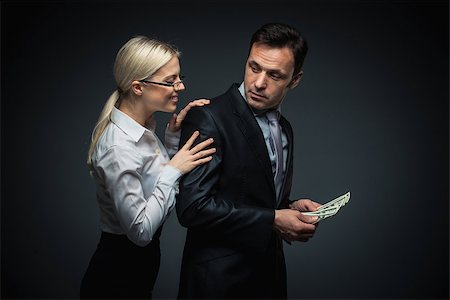 simsearch:400-04610806,k - Businessman and businesswoman with money Stock Photo - Budget Royalty-Free & Subscription, Code: 400-07580015