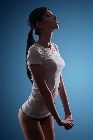 simsearch:400-04508759,k - girl in a T-shirt and shorts, blue background Stock Photo - Budget Royalty-Free & Subscription, Code: 400-07580189