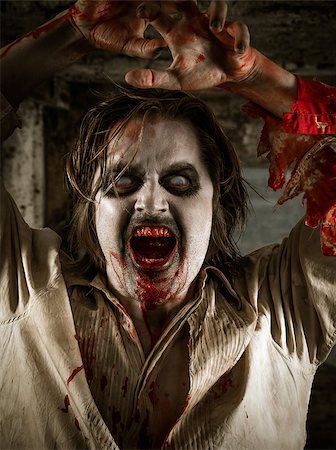simsearch:400-05352563,k - Photo of a hungry zombie covered with blood about to attack you. Fotografie stock - Microstock e Abbonamento, Codice: 400-07580811