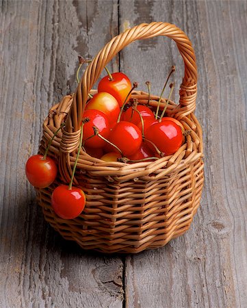simsearch:400-08020671,k - Sweet Maraschino Cherries in Wicker Basket isolated on Rustic Wooden background Stock Photo - Budget Royalty-Free & Subscription, Code: 400-07580872