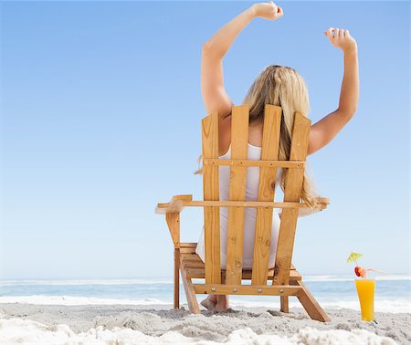 sunbed and cocktail - Pretty blonde sitting in deck chair with a cocktail on a sunny day Stock Photo - Budget Royalty-Free & Subscription, Code: 400-07581088