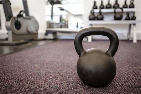 Black kettlebell on the weights room floor at the gym Stock Photo - Budget Royalty-Free & Subscription, Code: 400-07582885