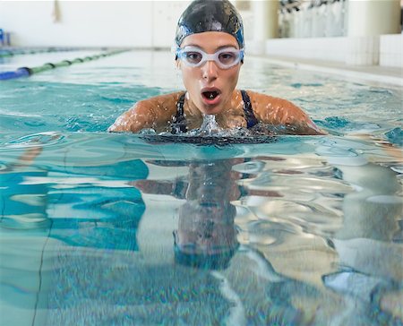 simsearch:400-07583085,k - Fit swimmer coming up for air in the swimming pool at the leisure center Stock Photo - Budget Royalty-Free & Subscription, Code: 400-07583058