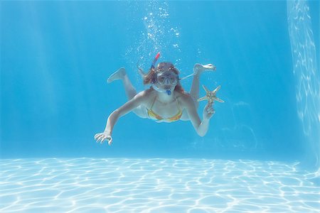 pictures of woman snorkeling underwater - Cute blonde underwater in the swimming pool with snorkel and starfish on their holidays Stock Photo - Budget Royalty-Free & Subscription, Code: 400-07583464