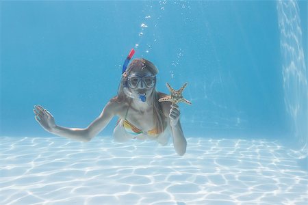 pictures of woman snorkeling underwater - Cute blonde underwater in the swimming pool with snorkel and starfish on their holidays Stock Photo - Budget Royalty-Free & Subscription, Code: 400-07583463