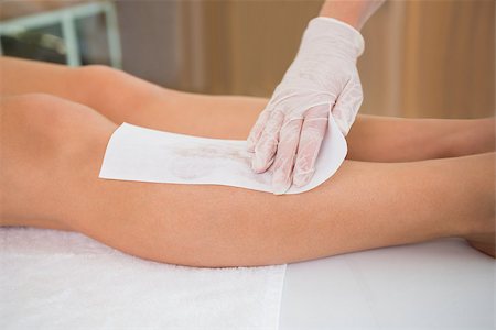 Woman getting her legs waxed by beauty therapist in the health spa Stock Photo - Budget Royalty-Free & Subscription, Code: 400-07583583