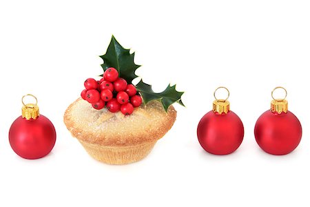 Christmas mince pie cake with red bauble decorations and holly over white background. Stock Photo - Budget Royalty-Free & Subscription, Code: 400-07614237