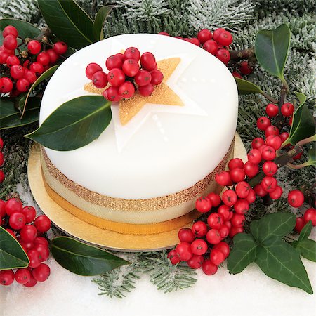 Christmas cake with snow, holly, ivy and fir background. Stock Photo - Budget Royalty-Free & Subscription, Code: 400-07614267