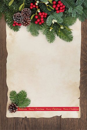 Merry christmas background border with fir, red berry sprays, mistletoe and pine cones over old parchment paper and oak wood. Stock Photo - Budget Royalty-Free & Subscription, Code: 400-07614334