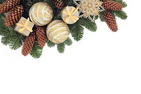 snow cone - Christmas background border with gold bauble decorations, pine cones and winter spruce fir over white with copy space. Photographie de stock - Aubaine LD & Abonnement, Code: 400-07614335