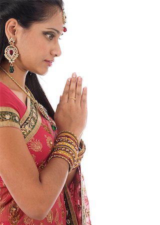 simsearch:400-08223620,k - Beautiful Indian woman in greeting or praying pose, traditional sari prayer isolated on white background with copy space on side. Stock Photo - Budget Royalty-Free & Subscription, Code: 400-07616583