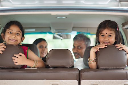 Happy Indian family sitting in car smiling, ready to vacation.  Asian parents and children. Stock Photo - Budget Royalty-Free & Subscription, Code: 400-07616592