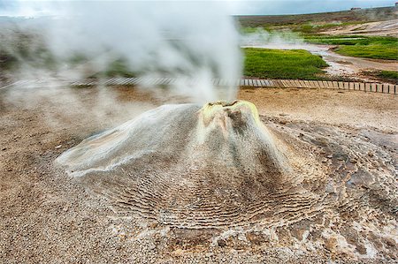 Fumarole in the geothermal area Hveravellir, central Iceland. The area around is layered and cracked. Stock Photo - Budget Royalty-Free & Subscription, Code: 400-07616861