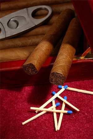 simsearch:400-05292494,k - cigars in the box and matchsticks, close up shallow dof Stock Photo - Budget Royalty-Free & Subscription, Code: 400-07617206