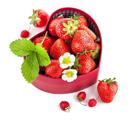 fresh strawberries in box as heart with green leaf with green leaf. Isolated on white background Stock Photo - Budget Royalty-Free & Subscription, Code: 400-07617271