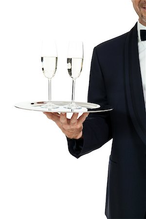 simsearch:400-05230474,k - adult male waiter serving two glass of champagne isolated on white Stock Photo - Budget Royalty-Free & Subscription, Code: 400-07617539