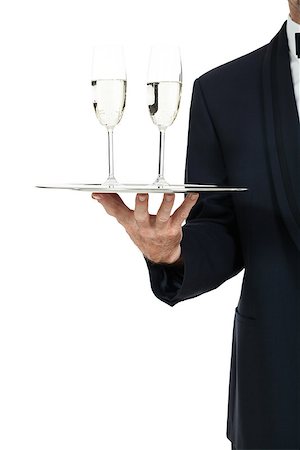 simsearch:400-05230474,k - adult male waiter serving two glass of champagne isolated on white Stock Photo - Budget Royalty-Free & Subscription, Code: 400-07617541