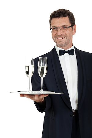 simsearch:400-05230474,k - adult male waiter serving two glass of champagne isolated on white Stock Photo - Budget Royalty-Free & Subscription, Code: 400-07617542