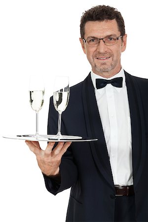 simsearch:400-05230474,k - adult male waiter serving two glass of champagne isolated on white Stock Photo - Budget Royalty-Free & Subscription, Code: 400-07617543