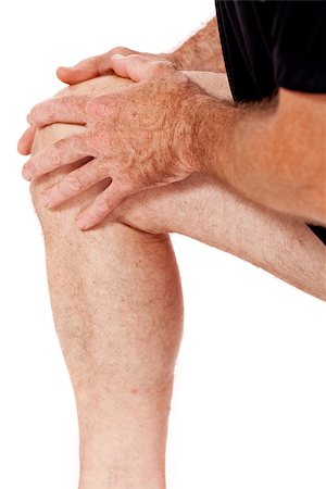 adult attractive man in sportswear knee pain injury ache isolated on white Stockbilder - Microstock & Abonnement, Bildnummer: 400-07617575