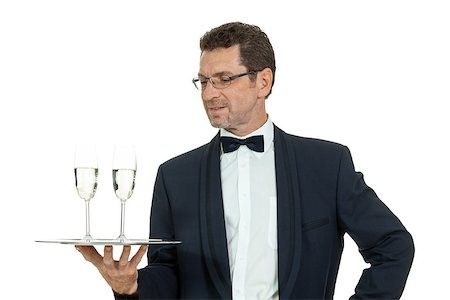 simsearch:400-05230474,k - adult male waiter serving two glass of champagne isolated on white Stock Photo - Budget Royalty-Free & Subscription, Code: 400-07617697