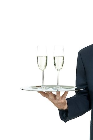 simsearch:400-05230474,k - adult male waiter serving two glass of champagne isolated on white Stock Photo - Budget Royalty-Free & Subscription, Code: 400-07617698