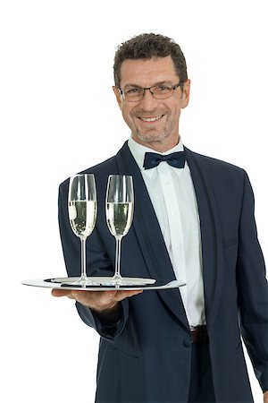 simsearch:400-05230474,k - adult male waiter serving two glass of champagne isolated on white Stock Photo - Budget Royalty-Free & Subscription, Code: 400-07617699