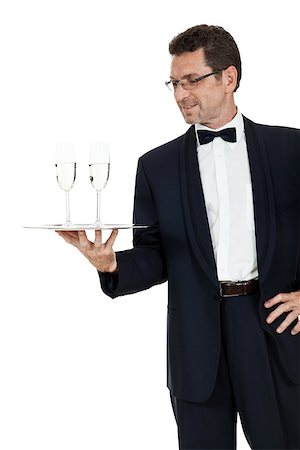 simsearch:400-05230474,k - adult male waiter serving two glass of champagne isolated on white Stock Photo - Budget Royalty-Free & Subscription, Code: 400-07617854