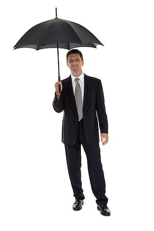 simsearch:400-04921907,k - mature attractive business man with umbrella isolated on white Stock Photo - Budget Royalty-Free & Subscription, Code: 400-07617850
