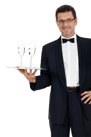 simsearch:400-05230474,k - adult male waiter serving two glass of champagne isolated on white Stock Photo - Budget Royalty-Free & Subscription, Code: 400-07617853