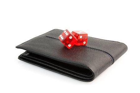 simsearch:400-06102745,k - red dice on the leather wallet on white background Photographie de stock - Aubaine LD & Abonnement, Code: 400-07618401