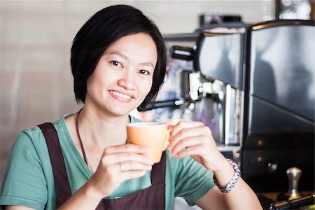 standing coffee bar - Asian barista enjoy her coffee, stock photo Stock Photo - Budget Royalty-Free & Subscription, Code: 400-07618418