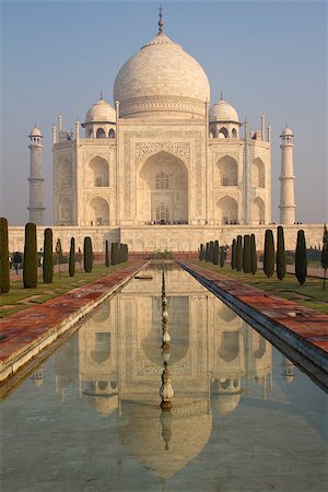 sun rise in agra - Vertical shot of Taj Mahal mausoleum, one of the 7 Wonders of the World. Early morning, blue sky, reflection in the pond. Stock Photo - Budget Royalty-Free & Subscription, Code: 400-07618413