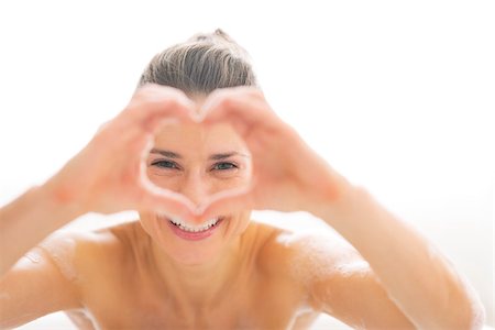 Young woman in bathtub looking through heart shaped hands Stock Photo - Budget Royalty-Free & Subscription, Code: 400-07618665