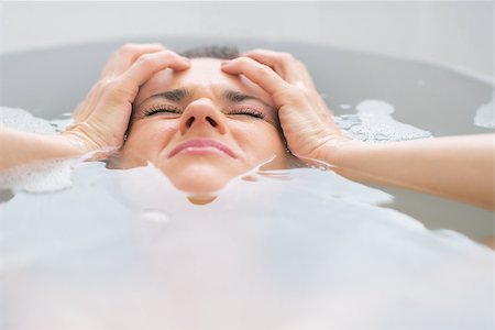 person laying in a tub - Stressed young woman laying in bathtub Stock Photo - Budget Royalty-Free & Subscription, Code: 400-07618689