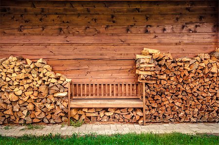 Detail of empty wooden bench with pile of firewood Stock Photo - Budget Royalty-Free & Subscription, Code: 400-07619320