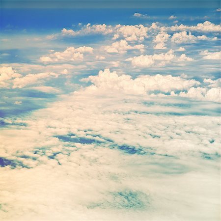 simsearch:400-04378611,k - clouds in a blue sky, view from airplane Stock Photo - Budget Royalty-Free & Subscription, Code: 400-07619498