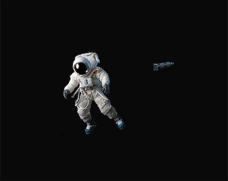 space with a person floating - An astronaut in black space.  He is American. Stock Photo - Budget Royalty-Free & Subscription, Code: 400-07613758